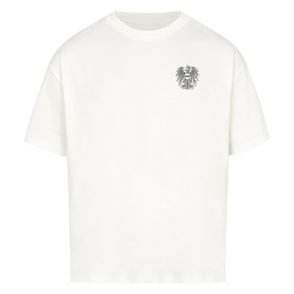 Graues Oversized T-Shirt von Pelasgia mit Österreich-Design, locker geschnitten, aus weicher Baumwolle, auf einem weißen Hintergrund.